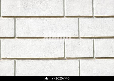 Background from a wall with white stone slabs Stock Photo