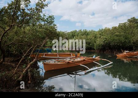 typical filipino boat on the bohol coast in the philippines Stock Photo