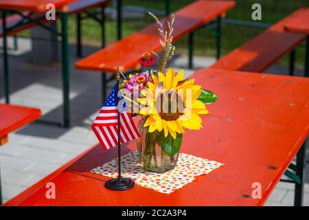 flower decoration with american and german flags on the table Stock Photo