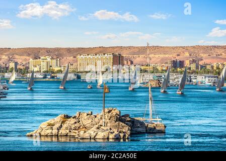 Row of sailboats on river Nile in Aswan, Egypt Stock Photo