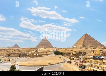 Pyramids and Sphinx on Giza plateau in desert of Egypt, view from above Stock Photo