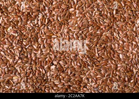 Full Frame Shot of a Bunch of Brown Flaxseeds Stock Photo