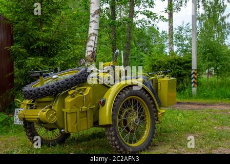 Restored bright green retro motorcycle with sidecar Stock Photo