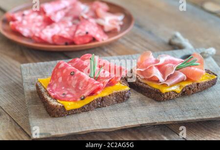 Spanish sandwiches with salchichon anb jamon close-up Stock Photo