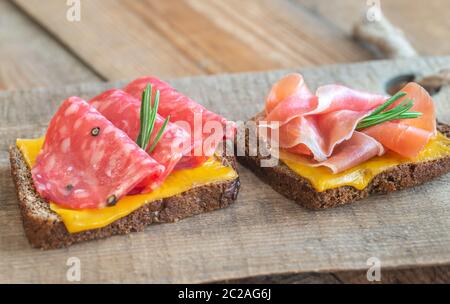 Spanish sandwiches with salchichon anb jamon close-up Stock Photo