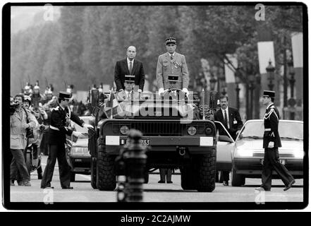 President of France Francois Mitterrand and Jaques Chirac Mayor of Paris at the 1988 Bastille day celebrations during the Presidential and national Assembly elections in 1988.  Bastille Day is the common name given in English-speaking countries to the national day of France, which is celebrated on 14 July each year. In French, it is formally called Fête nationale 'National Celebration' and commonly and legally le 14 juillet; 'the 14th of July').  The French National Day is the anniversary of Storming of the Bastille on 14 July 1789, a turning point of the French Revolution, as well as the Fête Stock Photo