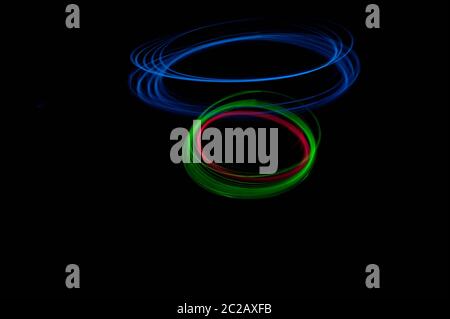 colored streaks of light in the dark Stock Photo