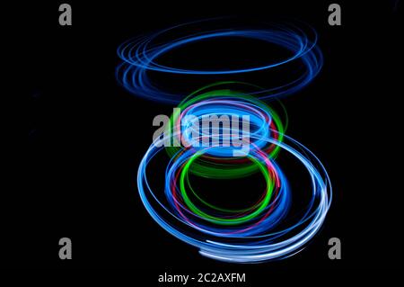 colored streaks of light in the dark Stock Photo