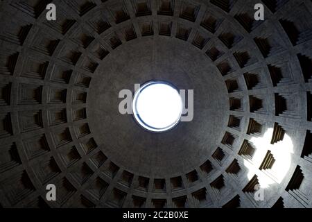 The interior dome of the Pantheon temple, with a center hole for the sunlight, founded  during the Roman Empire, in Rome. Stock Photo