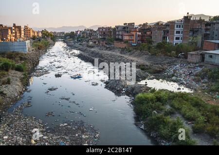 Contaminated river runs through city. waste is discarded river bank. lack of waste collection services. Kathmandu, Nepal, Asia Stock Photo