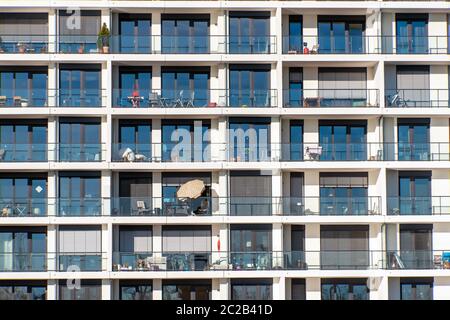 Glass facade of a modern apartment building with a lot of balconies seen in Hamburg, Germany Stock Photo