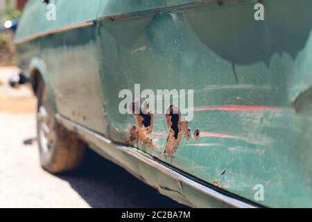broken part of car body with rusty on concrete floor Stock Photo