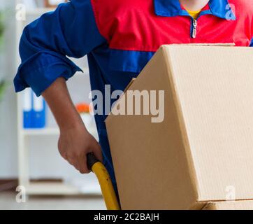 Young man working in relocation services with boxes Stock Photo