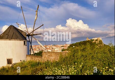 Windmill at the Serra do Louro and the castle of Palmela. Arrabida Nature Park, Palmela. Portugal Stock Photo