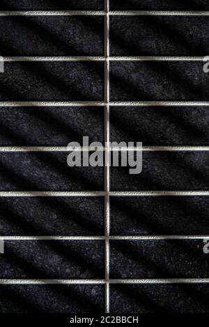 Thin lines of light on the wall. Shadow from the blinds. bathroom. Stock Photo