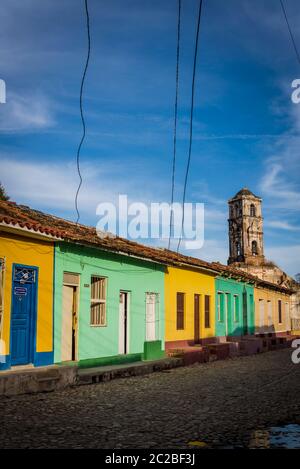 Empty cobblestone street and quaint Spanish style colonial architecture in Santa Ana residential neighbourhood of the city centre, Trinidad, Cuba Stock Photo