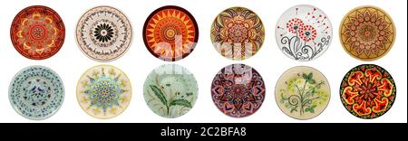 Set of decorative ceramic dishes hand-painted with acrylic paints floral pattern isolated on white background Stock Photo