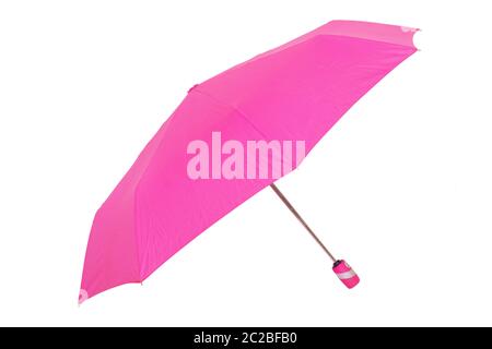 Umbrella isolated. Close-up of beautiful open pink umbrella isolated on a white background.  Fashionable female accessories for the rain season. Stock Photo