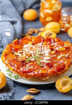 Homemade tarte tatin pie with apricots and thyme. Stock Photo