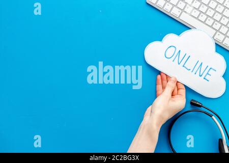 Cloud online networking concept. Paper bubble on blue workplace Stock Photo