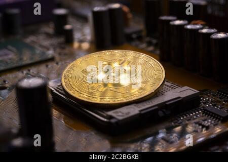 Bitcoin coin and printed circuit board PCB Stock Photo