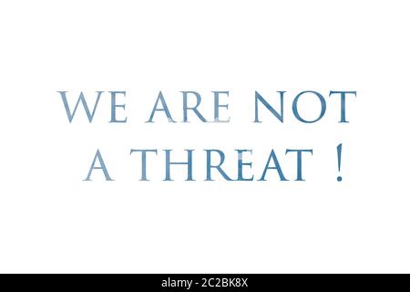 No Racism. Stop Racism. We are not a threat Sign with Dramatic Clouds and Sky. Stock Photo