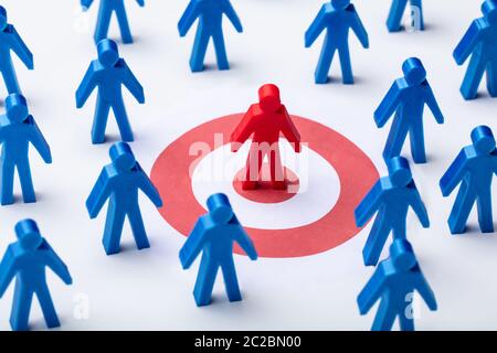 Blue Human Figure And Darts Target On White Background Stock Photo