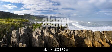 A panoramic view of the famous 'pancake rocks' at Punakaiki on the west coast of New Zealand's south island. Stock Photo