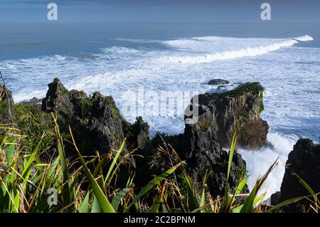 Large waves roll in at Punakaiki on the west coast of New Zealand's south island. Stock Photo
