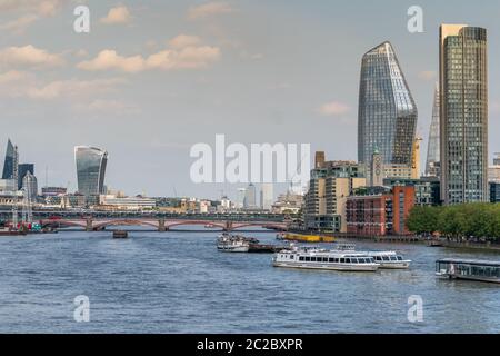 LONDON, ENGLAND - MAY 27, 2020: Panoramic view of the London city skyline taken from Waterloo Bridge over the Thames River towards London's iconic bui Stock Photo