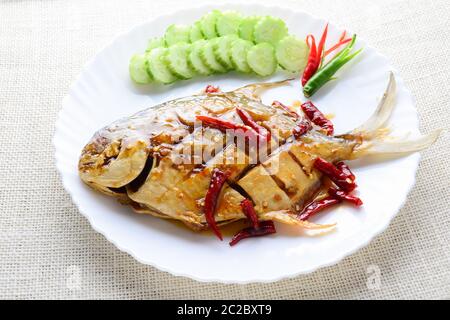 Deep Fried White Pomfret With Black Pepper Garlic, quick and easy dish. Stock Photo