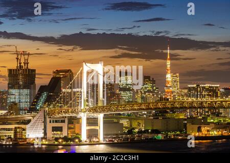 Aerial view of Tokyo skylines with Rainbow bridge and tokyo tower over Tokyo bay Sunset Twilight from Odaiba in Tokyo city Kanto Japan. Stock Photo