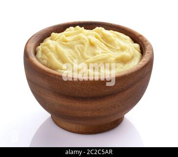 Mashed potatoes in wooden bowl isolated on white background Stock Photo