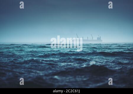 Sea ripple water with rain and ship Stock Photo