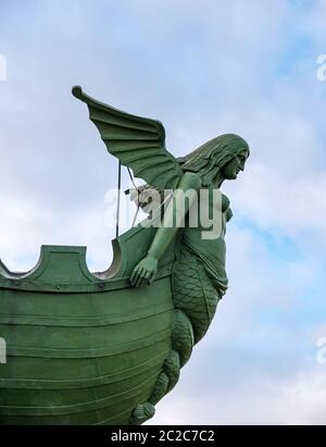 Winged mermaid on rostral or victory column on The Spit, Vasilyevsky Island, St Petersburg, Russia Stock Photo