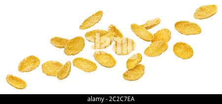 Falling corn flakes, traditional breakfast cereal isolated on white background Stock Photo