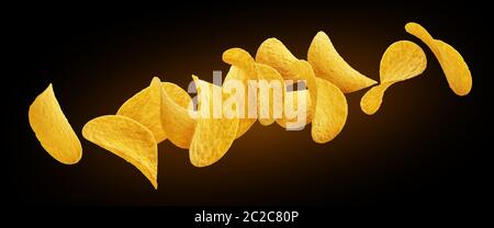 Falling potato chips isolated on black background Stock Photo