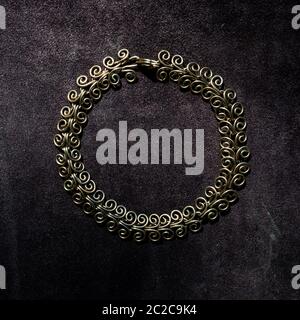 Handmade copper chain necklace on leather surface. Stock Photo