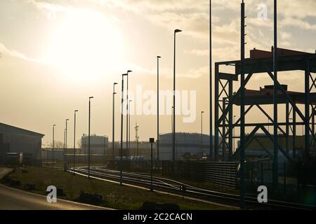 Road through an industrial area in the north of Magdeburg in Germany Stock Photo