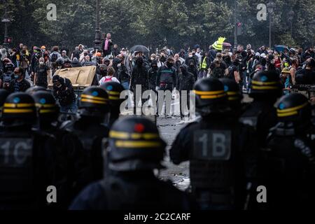 Paris, France. 16th June, 2020. French riot police are seen during clashes with violent fringe groups during a health workers' rally in Paris, France, June 16, 2020. Tensions flared at the Invalides Esplanade here on Tuesday, where violent fringe groups hijacked a health workers' rally for better work conditions and higher wages. Twenty-four individuals had been arrested by 17:00 local time (1500 GMT), the Paris prefecture said. Credit: Aurelien Morissard/Xinhua/Alamy Live News Stock Photo