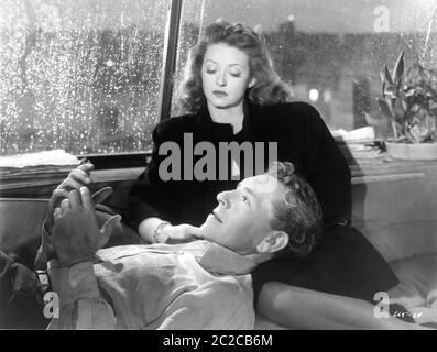 BETTE DAVIS and PAUL HENRIED in DECEPTION 1946 director IRVING RAPPER music Erich Wolfgang Korngold Warner Bros. Stock Photo