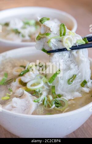 Delicious fish ball rice noodles in thick soup, common food in Tainan, Taiwan, Asia, Asian Taiwanese street delicacy cuisine, close up, lifestyle. Stock Photo