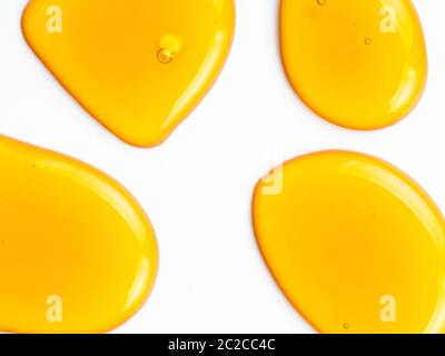 Honey drops abstract pattern, isolated on white Stock Photo