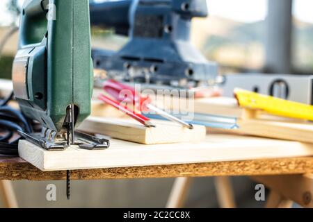 Professional woodworking tools, manual electric saw for cutting wood. Housework do it yourself. Stock photography. Stock Photo