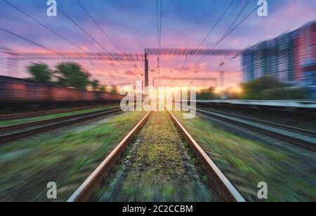 Railroad and sky with clouds at sunset with motion blur effect Stock Photo