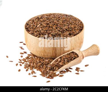 Flax seeds isolated on white background with clipping path, close-up of flaxseed in wooden scoop and bowl Stock Photo