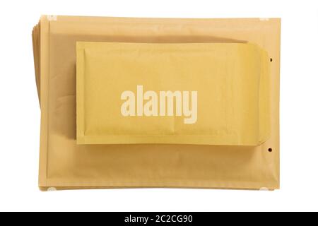Stack of padded mailing envelopes isolated against a white background Stock Photo
