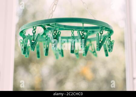 Colored clothespins on a rope on a blurred background Stock Photo