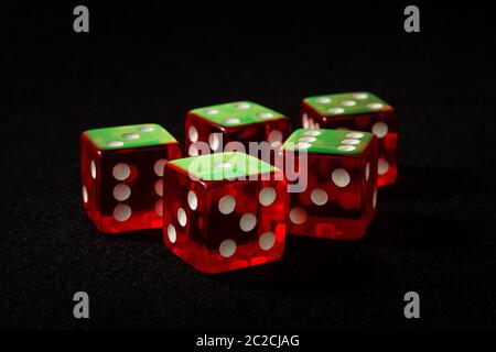 red dice on a black felt Stock Photo
