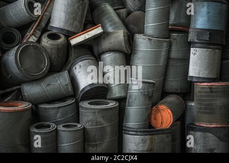 Pile of Used Large Heavy Duty Semi Truck and Coach Bus Diesel Engine Air Filters. Transportation Industry. Stock Photo